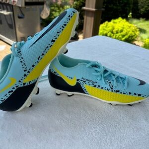 Blue and yellow soccer nike cleats